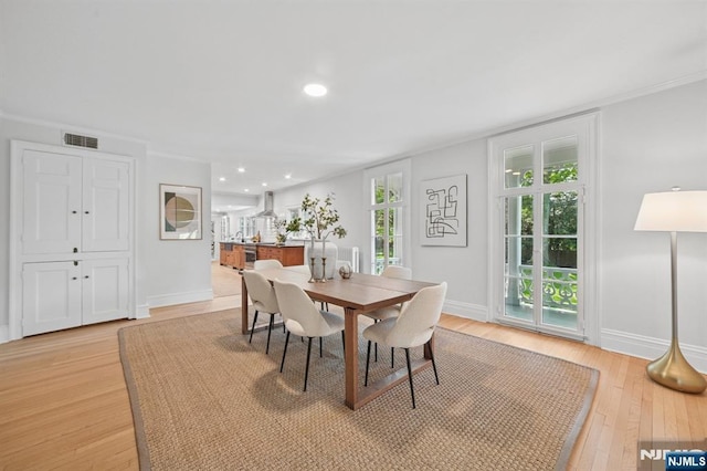 249 Valley Rd, Montclair, NJ 07042 - dining room with light wood-style flooring, baseboards, recessed lighting, and crown molding