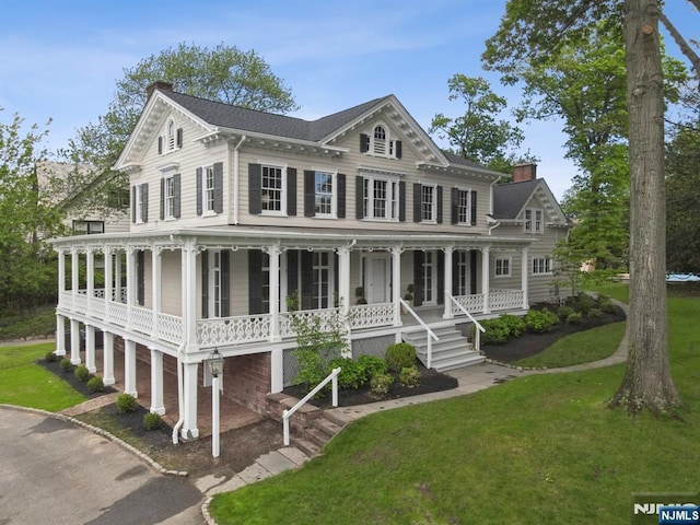 249 Valley Rd, Montclair, NJ 07042 - view of front of home with a porch, a front lawn, and a chimney