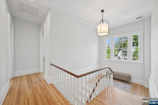 249 Valley Rd, Montclair, NJ 07042 - hall featuring an upstairs landing, wood-type flooring, and baseboards