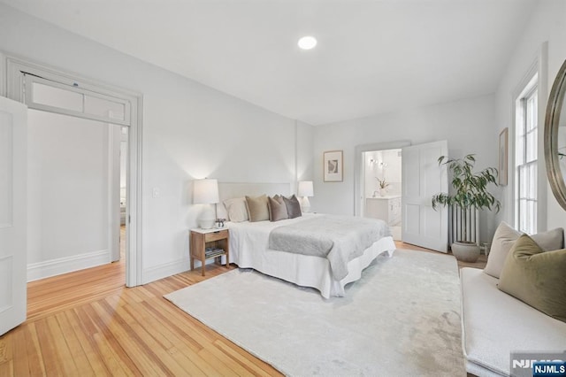 249 Valley Rd, Montclair, NJ 07042 - bedroom featuring light wood-style flooring, baseboards, connected bathroom, and recessed lighting