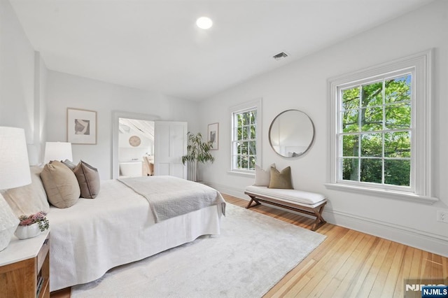 249 Valley Rd, Montclair, NJ 07042 - bedroom featuring baseboards, hardwood / wood-style flooring, and ensuite bath