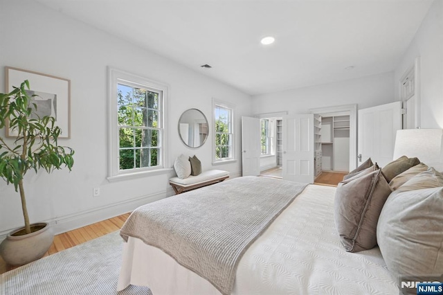 249 Valley Rd, Montclair, NJ 07042 - bedroom with light wood finished floors, baseboards, recessed lighting, and a spacious closet