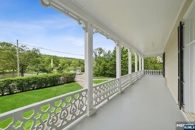 249 Valley Rd, Montclair, NJ 07042 - porch with a water view, a lawn, and view of wooded area