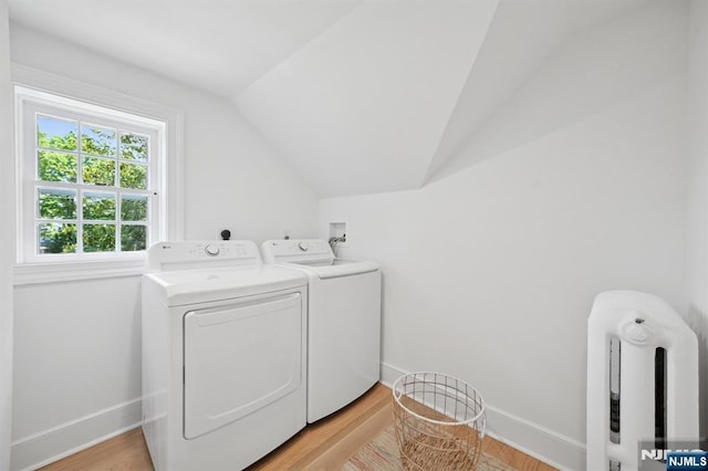 249 Valley Rd, Montclair, NJ 07042 - washroom with washing machine and dryer, baseboards, and light wood finished floors