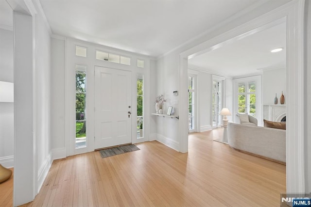 249 Valley Rd, Montclair, NJ 07042 - foyer featuring wood finished floors, ornamental molding, and baseboards
