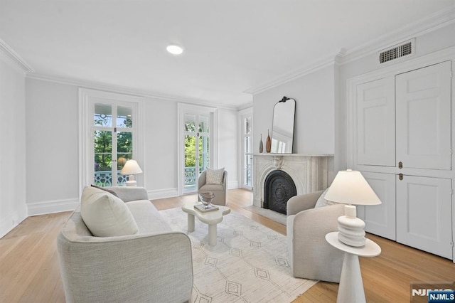 249 Valley Rd, Montclair, NJ 07042 - living room with a fireplace, ornamental molding, light wood finished floors, baseboards, and recessed lighting