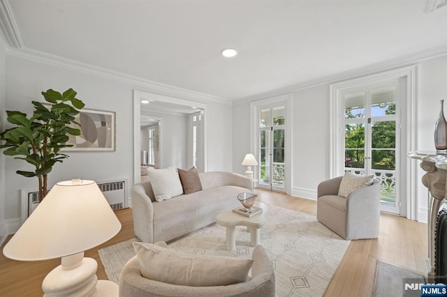 249 Valley Rd, Montclair, NJ 07042 - living area featuring radiator heating unit, crown molding, wood finished floors, recessed lighting, and baseboards