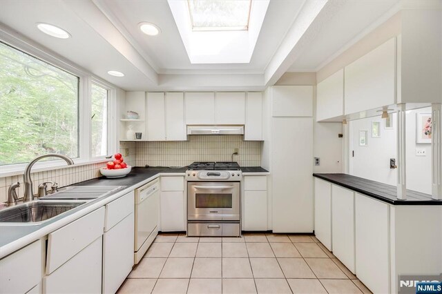 60 Leach Dr, Bloomingdale, NJ 07403 - kitchen with stainless steel gas range oven, white dishwasher, under cabinet range hood, a sink, and open shelves