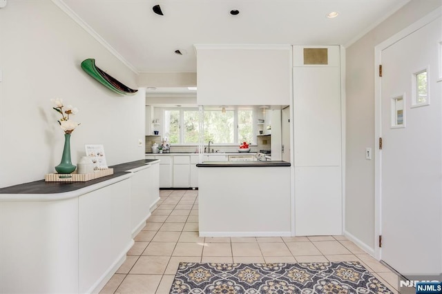 60 Leach Dr, Bloomingdale, NJ 07403 - kitchen featuring white cabinetry, dark countertops, light tile patterned flooring, ornamental molding, and open shelves
