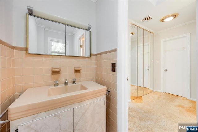 60 Leach Dr, Bloomingdale, NJ 07403 - bathroom featuring ornamental molding, vanity, and tile walls