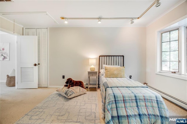 60 Leach Dr, Bloomingdale, NJ 07403 - carpeted bedroom featuring attic access, track lighting, ornamental molding, and a baseboard radiator