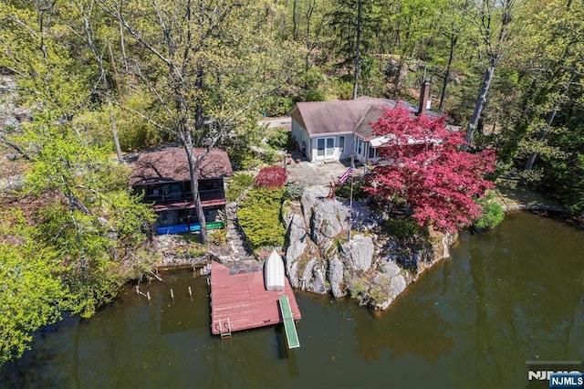 60 Leach Dr, Bloomingdale, NJ 07403 - view of subject property featuring a heavily wooded area and a nearby body of water