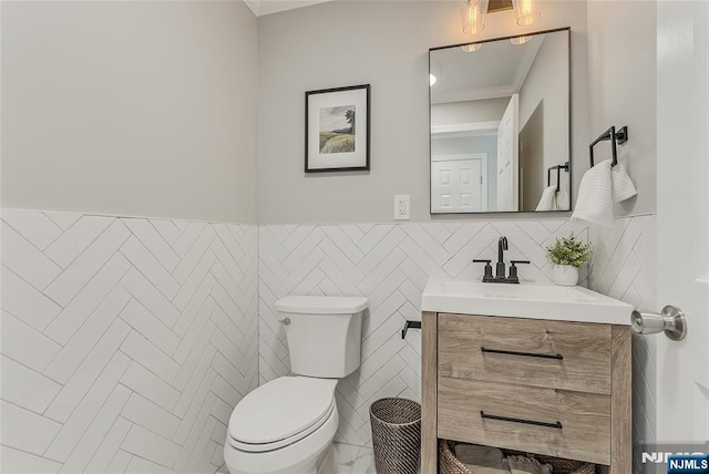 61 Ferndale Rd, Paramus, NJ 07652 - bathroom featuring vanity, toilet, ornamental molding, and tile walls