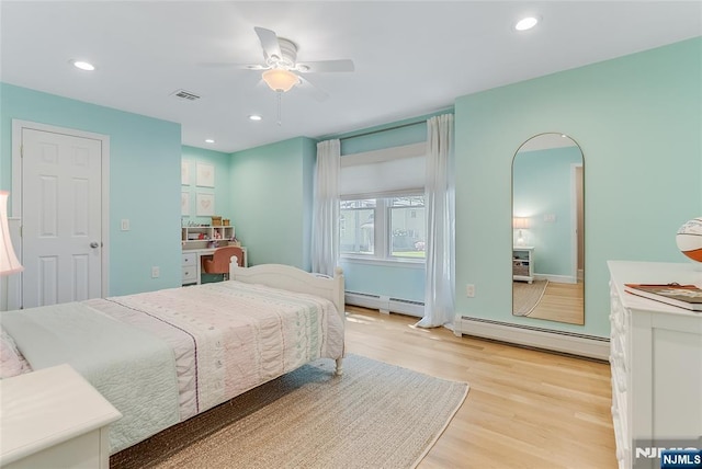 61 Ferndale Rd, Paramus, NJ 07652 - bedroom with baseboard heating, light wood-style floors, ceiling fan, and recessed lighting