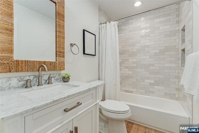 61 Ferndale Rd, Paramus, NJ 07652 - full bathroom with vanity, toilet, shower / bathtub combination with curtain, wood finished floors, and recessed lighting