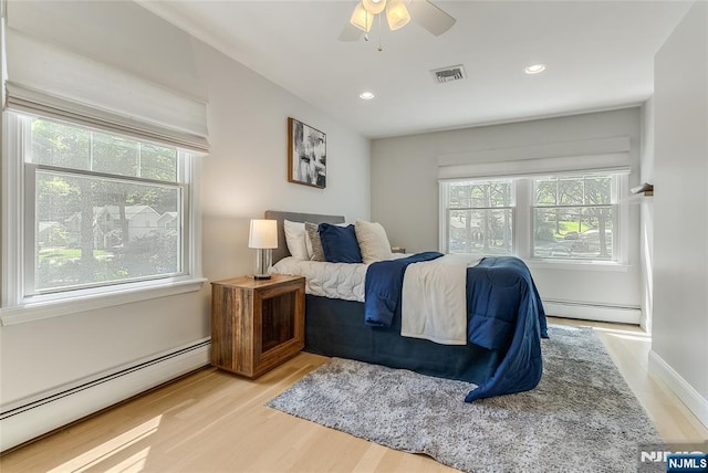 61 Ferndale Rd, Paramus, NJ 07652 - bedroom featuring baseboard heating, light wood-style floors, recessed lighting, and ceiling fan