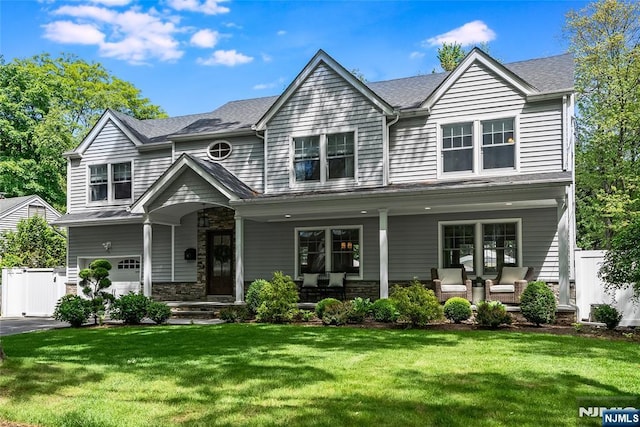 61 Ferndale Rd, Paramus, NJ 07652 - view of front of property featuring covered porch, a garage, stone siding, and roof with shingles