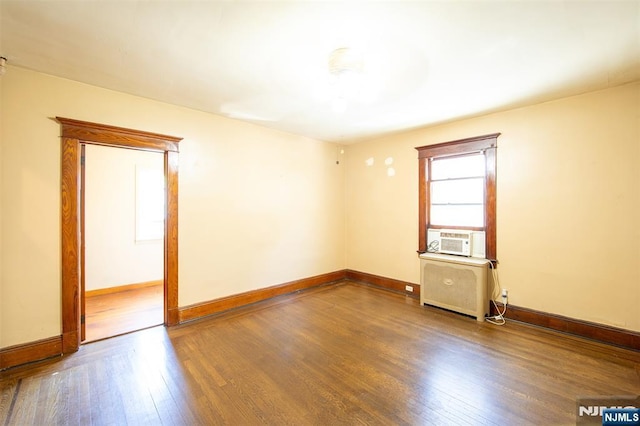 65 Byrne St, Hackensack, NJ 07601 - unfurnished room with hardwood / wood-style flooring, radiator heating unit, cooling unit, and baseboards