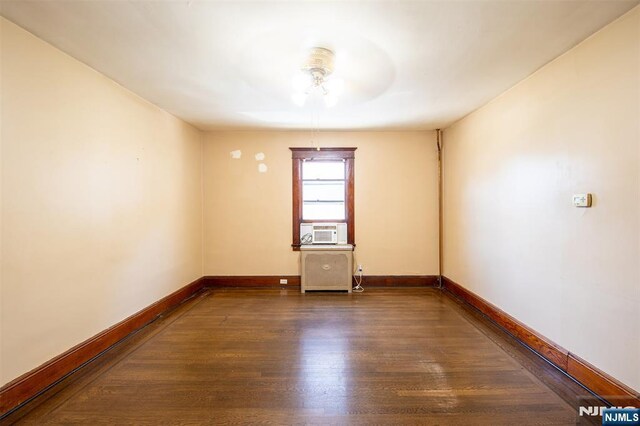 65 Byrne St, Hackensack, NJ 07601 - empty room with ceiling fan, wood finished floors, baseboards, and cooling unit