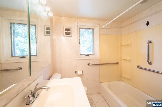 65 Byrne St, Hackensack, NJ 07601 - full bathroom with toilet, tile walls, vanity, bathing tub / shower combination, and tile patterned floors