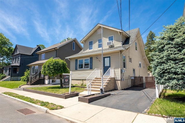 65 Byrne St, Hackensack, NJ 07601 - view of front of property featuring cooling unit and a gate