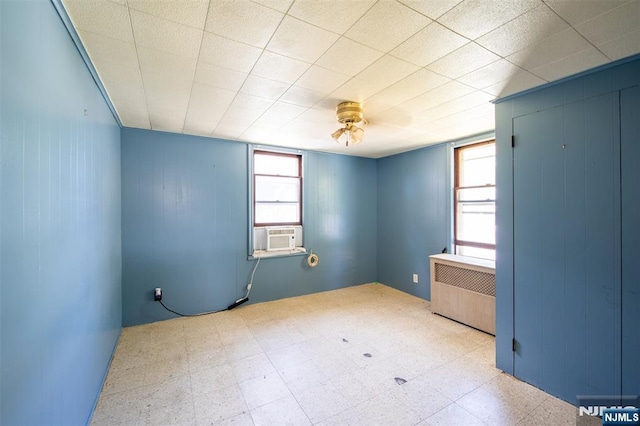 65 Byrne St, Hackensack, NJ 07601 - unfurnished room featuring radiator, tile patterned floors, cooling unit, and a ceiling fan