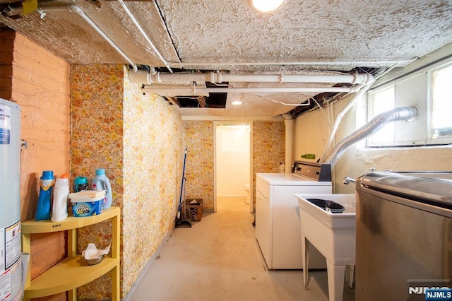 65 Byrne St, Hackensack, NJ 07601 - basement with washer and dryer, gas water heater, and a sink