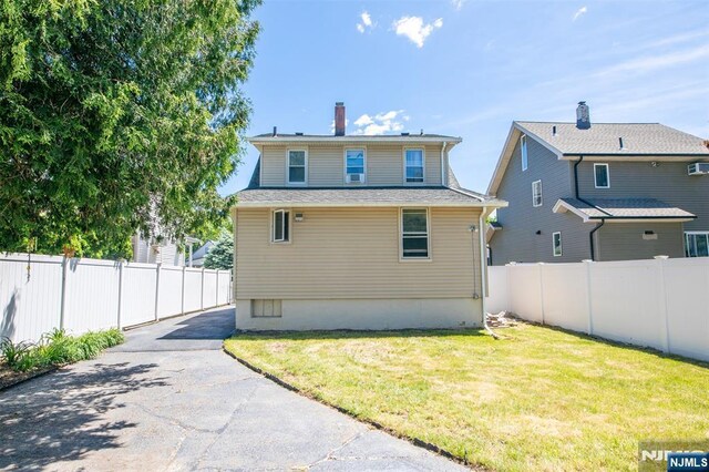 65 Byrne St, Hackensack, NJ 07601 - back of property with a chimney