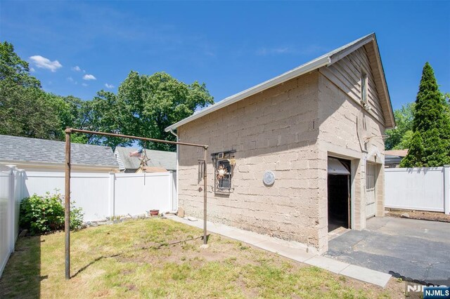 65 Byrne St, Hackensack, NJ 07601 - view of side of property featuring asphalt driveway