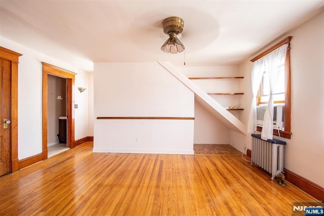 65 Byrne St, Hackensack, NJ 07601 - bonus room with radiator heating unit, a ceiling fan, light wood finished floors, and baseboards
