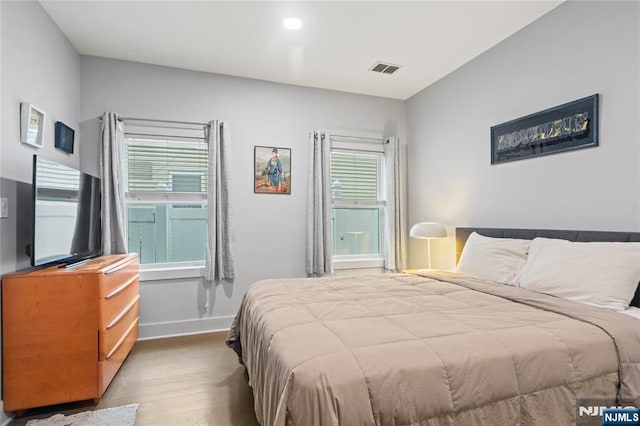 172 S St Unit 2A, Jersey City, NJ 07307 - bedroom featuring wood finished floors and baseboards