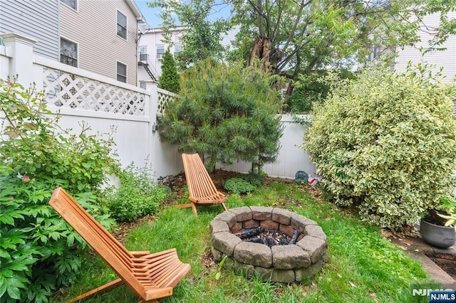 172 S St Unit 2A, Jersey City, NJ 07307 - fenced backyard with a fire pit
