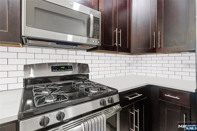 172 S St Unit 2A, Jersey City, NJ 07307 - kitchen featuring appliances with stainless steel finishes, light countertops, dark brown cabinetry, and decorative backsplash