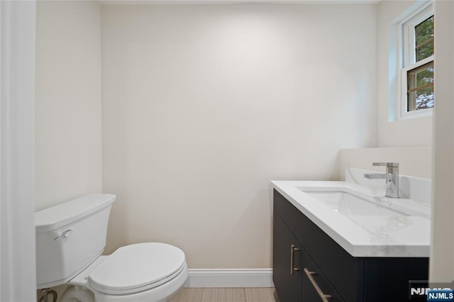 16 Coles Ct, River Edge, NJ 07661 - half bath with vanity, toilet, and baseboards