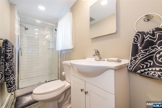 16 Dalewood Rd, Wayne, NJ 07470 - full bathroom with a baseboard heating unit, tiled shower, vanity, toilet, and recessed lighting