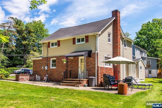 16 Dalewood Rd, Wayne, NJ 07470 - back of property with a chimney, a patio, a yard, brick siding, and a shed