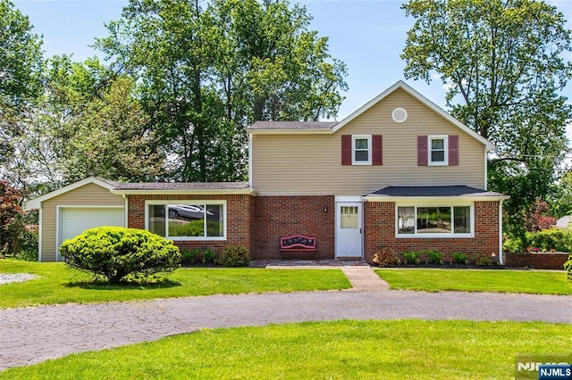 16 Dalewood Rd, Wayne, NJ 07470 - traditional-style house featuring a front yard, brick siding, a garage, and roof with shingles