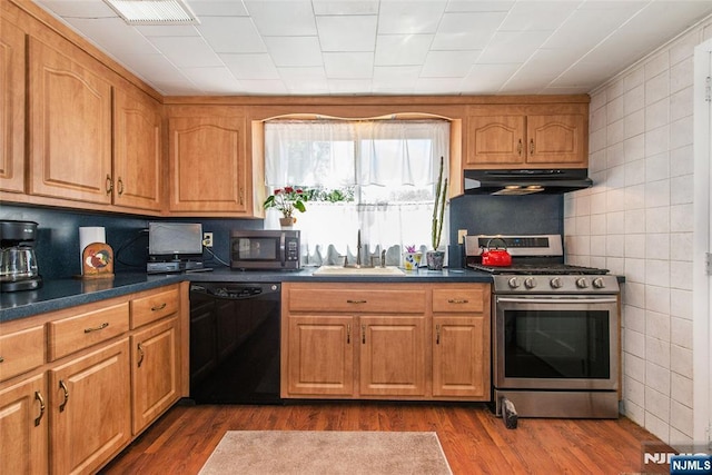 16 Dalewood Rd, Wayne, NJ 07470 - kitchen featuring stainless steel appliances, under cabinet range hood, a sink, dark countertops, and decorative backsplash