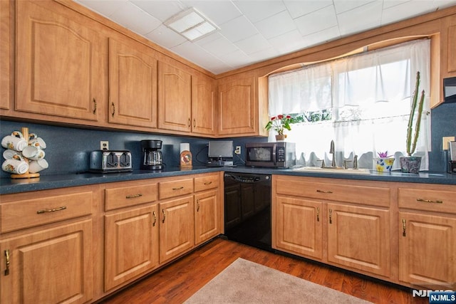 16 Dalewood Rd, Wayne, NJ 07470 - kitchen with black dishwasher, stainless steel microwave, a sink, dark countertops, and dark wood-style floors