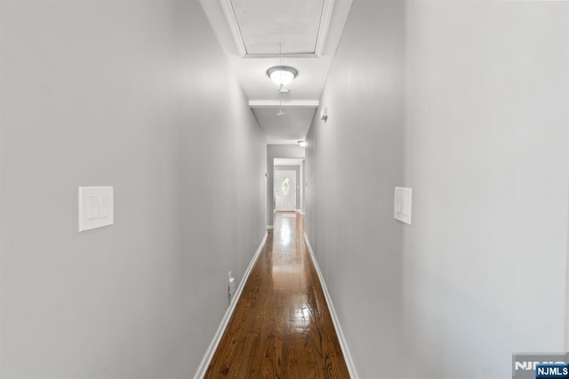 97 Avenue Ave, Lodi, NJ 07644 - corridor featuring attic access, wood finished floors, and baseboards