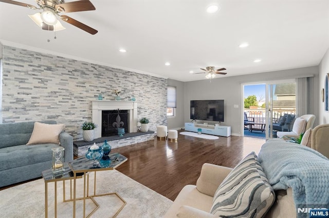 97 Avenue Ave, Lodi, NJ 07644 - living area with a ceiling fan, healthy amount of natural light, wood finished floors, recessed lighting, and a fireplace with raised hearth