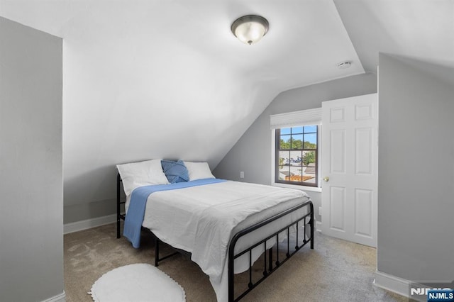 97 Avenue Ave, Lodi, NJ 07644 - carpeted bedroom with vaulted ceiling and baseboards