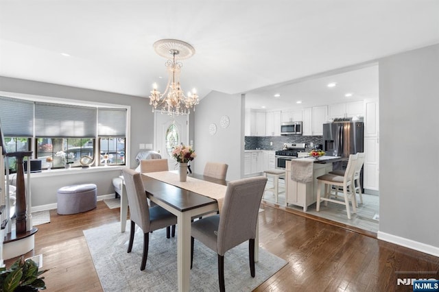 97 Avenue Ave, Lodi, NJ 07644 - dining space featuring wood finished floors, a chandelier, recessed lighting, and baseboards