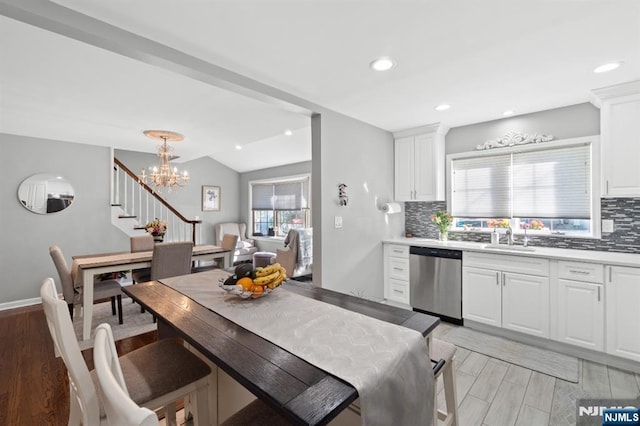 97 Avenue Ave, Lodi, NJ 07644 - kitchen with dishwasher, decorative backsplash, a sink, light wood-style flooring, and recessed lighting