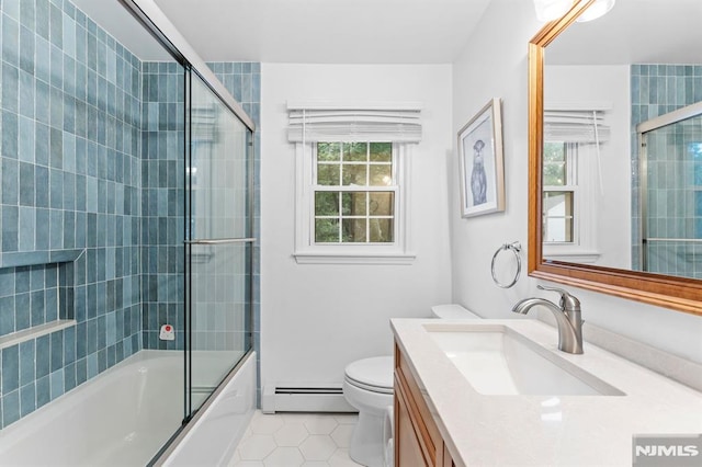 4 Kimberly Way, River Edge, NJ 07661 - bathroom with baseboard heating, tile patterned floors, vanity, combined bath / shower with glass door, and toilet