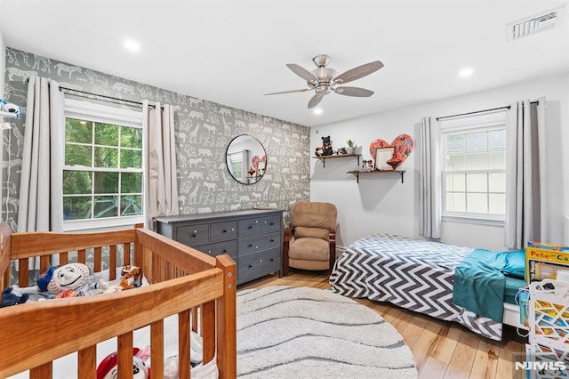 4 Kimberly Way, River Edge, NJ 07661 - bedroom featuring wallpapered walls, wood finished floors, an accent wall, recessed lighting, and a ceiling fan