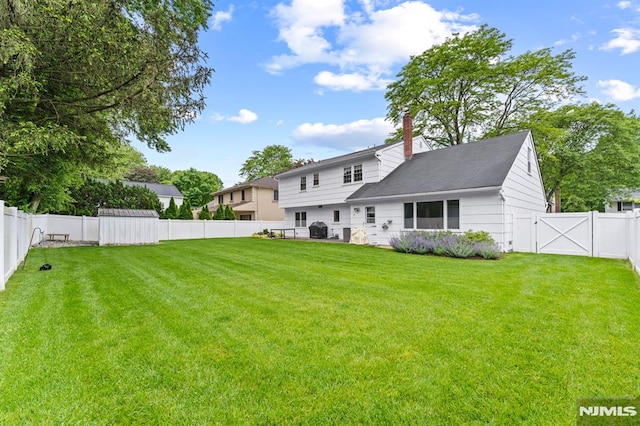4 Kimberly Way, River Edge, NJ 07661 - back of house with a chimney and a gate