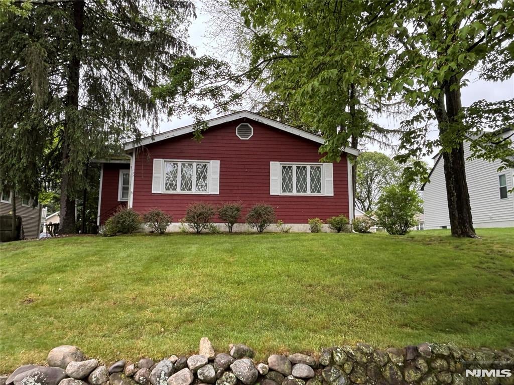 137 Myrtle, Allendale, NJ 07401 - view of side of home with a yard