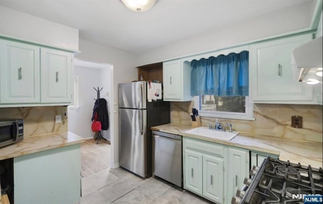 202 Linden Ave, Verona, NJ 07044 - kitchen featuring stainless steel appliances, a sink, light countertops, and backsplash