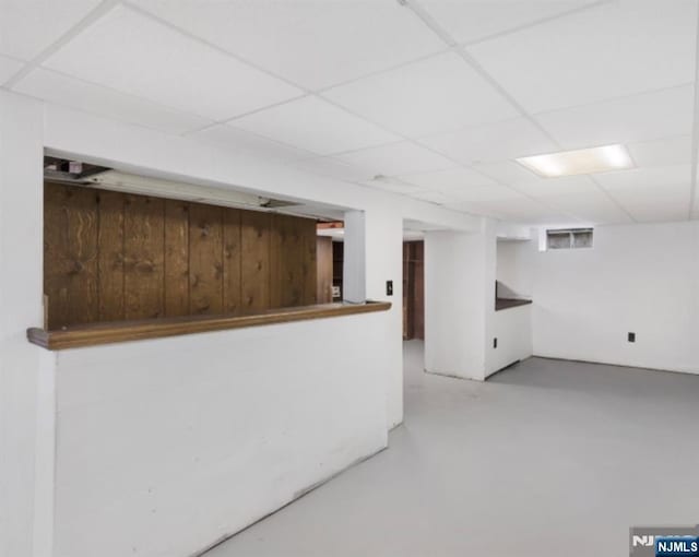 202 Linden Ave, Verona, NJ 07044 - bar featuring wood walls, a paneled ceiling, and finished concrete floors